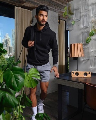 Aquamarine Shorts Outfits For Men: Choose a black hoodie and aquamarine shorts if you're on a mission for an outfit option that is all about bold casual style. A pair of white canvas low top sneakers is a smart choice to complement your look.