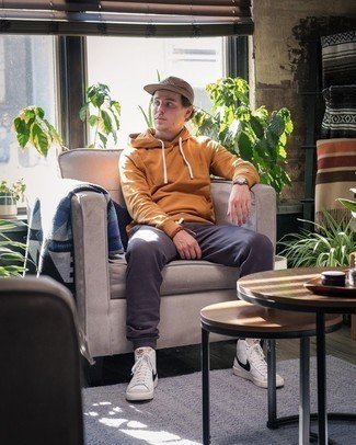 Brown Baseball Cap Outfits For Men: A tobacco hoodie and a brown baseball cap have become a staple off-duty combination for many fashionable gentlemen. Finishing off with white and black leather high top sneakers is a surefire way to bring a bit of flair to your outfit.