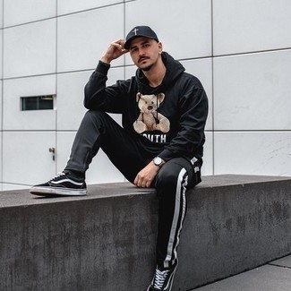 Black and White Sweatpants Outfits For Men: For something more on the cool and laid-back end, pair a black print hoodie with black and white sweatpants. Feeling creative today? Break up this ensemble by wearing a pair of black and white canvas low top sneakers.