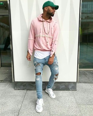 Hot Pink Sweater Outfits For Men: For a look that's very straightforward but can be flaunted in a myriad of different ways, go for a hot pink sweater and light blue ripped skinny jeans. Go the extra mile and shake up your outfit by slipping into white low top sneakers.