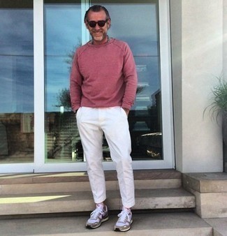 Pink Sweatshirt Outfits For Men: For something more on the casual and cool side, wear this combo of a pink sweatshirt and white chinos. Finishing off with a pair of grey athletic shoes is a surefire way to introduce a more relaxed twist to your ensemble.