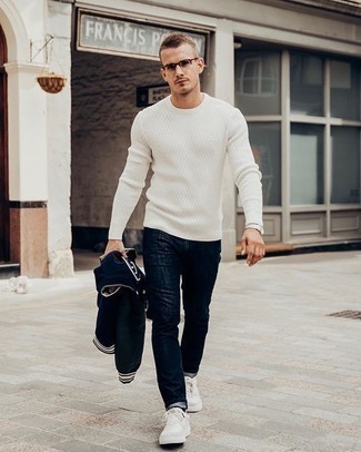 Men's White Canvas Low Top Sneakers, Navy Jeans, White Cable Sweater, Navy Varsity Jacket