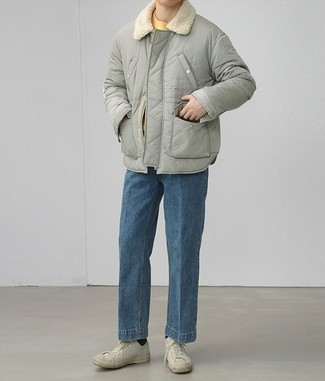 Men's White Canvas Low Top Sneakers, Blue Jeans, Mustard Crew-neck T-shirt, Grey Puffer Jacket