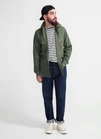 Men's White Canvas Low Top Sneakers, Navy Jeans, White and Black Horizontal Striped Crew-neck T-shirt, Olive Shirt Jacket