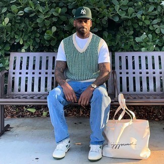 Men's White and Green Leather Low Top Sneakers, Light Blue Jeans, White Crew-neck T-shirt, Dark Green Print Sweater Vest