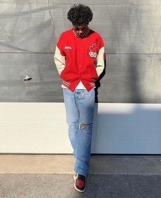 Men's Red and Black Suede Low Top Sneakers, Light Blue Ripped Jeans, White Crew-neck T-shirt, Red Varsity Jacket