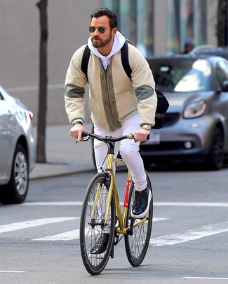 Justin Theroux wearing Black Leather Low Top Sneakers, White Jeans, White Hoodie, Beige Fleece Bomber Jacket