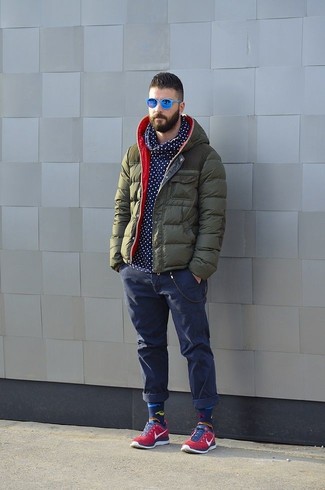 Men's Red Low Top Sneakers, Navy Jeans, Navy and White Polka Dot Hoodie, Olive Puffer Jacket