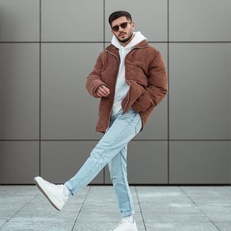 Men's White Canvas Low Top Sneakers, Light Blue Jeans, White Hoodie, Brown Puffer Jacket