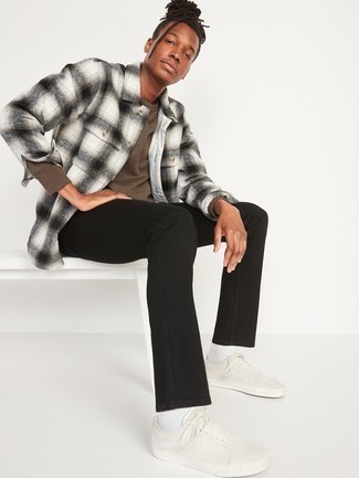 Men's White Canvas Low Top Sneakers, Black Jeans, White and Black Plaid Flannel Long Sleeve Shirt, Brown Sweatshirt
