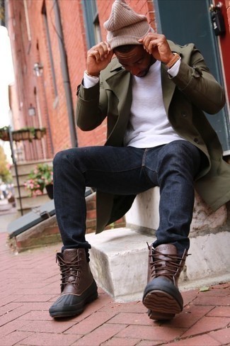 Men's Brown Leather Snow Boots, Navy Jeans, White Long Sleeve T-Shirt, Olive Trenchcoat