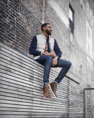 Men's Brown Leather Desert Boots, Navy Jeans, Tan Turtleneck, White and Navy Varsity Jacket