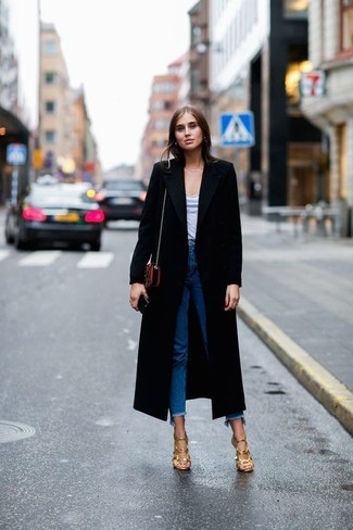 Women's Gold Leather Heeled Sandals, Blue Fringe Jeans, Grey V-neck T-shirt, Black Coat