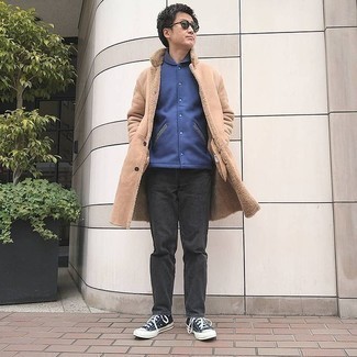 Men's Black and White Canvas Low Top Sneakers, Black Jeans, Navy Varsity Jacket, Tan Shearling Coat