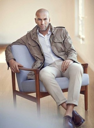 Beige Military Jacket Outfits For Men: Pair a beige military jacket with beige dress pants if you're going for a neat, stylish look. Let your styling credentials truly shine by completing this outfit with a pair of dark brown leather derby shoes.