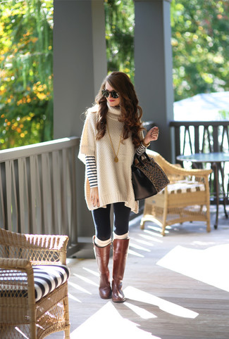 Women's Brown Leather Knee High Boots, Black Leggings, White and Navy Horizontal Striped Crew-neck Sweater, Beige Poncho