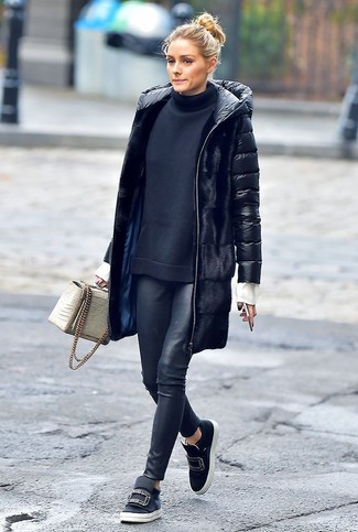 Olivia Palermo wearing Black Embellished Leather Slip-on Sneakers, Black Leather Leggings, Black Turtleneck, Black Puffer Coat