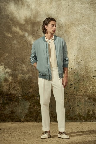 Tan Polo Outfits For Men: A tan polo and white chinos are absolute menswear must-haves if you're piecing together an off-duty closet that matches up to the highest fashion standards. Let your outfit coordination credentials truly shine by rounding off this look with a pair of white canvas boat shoes.