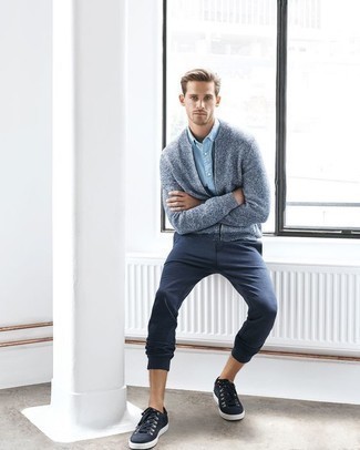 Navy and White Canvas Low Top Sneakers Outfits For Men: A light blue knit bomber jacket and navy chinos are indispensable menswear staples if you're figuring out an off-duty wardrobe that matches up to the highest sartorial standards. Navy and white canvas low top sneakers are a nice pick to finish off your look.