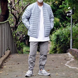 Grey Cargo Pants Outfits: A light blue quilted bomber jacket and grey cargo pants are the kind of a tested off-duty ensemble that you need when you have zero time to dress up. Inject a playful vibe into this look by sporting grey athletic shoes.