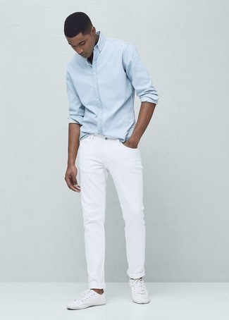 White Canvas Low Top Sneakers with Light Blue Chambray Long Sleeve Shirt Casual Outfits For Men: A light blue chambray long sleeve shirt and white jeans will infuse serious style into your daily casual arsenal. We're totally digging how a pair of white canvas low top sneakers makes this outfit complete.
