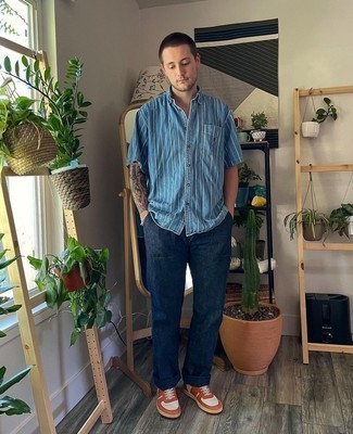 Men's Light Blue Vertical Striped Chambray Short Sleeve Shirt, Navy Jeans, Orange Leather Low Top Sneakers