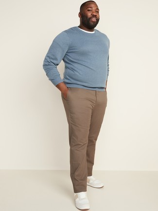 Light Blue Crew-neck Sweater Outfits For Men: Want to infuse your menswear arsenal with some fashion-forward cool? Reach for a light blue crew-neck sweater and khaki chinos. Our favorite of an infinite number of ways to complement this ensemble is with white leather low top sneakers.
