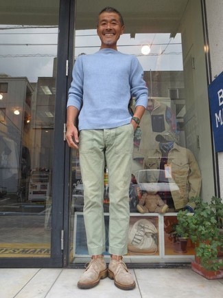 Olive Watch Outfits For Men: This laid-back combination of a light blue crew-neck sweater and an olive watch is very versatile and up for whatever the day throws at you. Add beige suede desert boots to your outfit to immediately step up the style factor of this outfit.