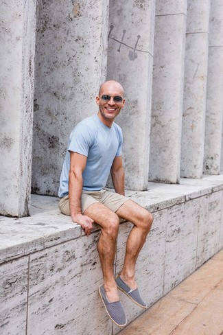 Navy and White Canvas Espadrilles Outfits For Men: This laid-back pairing of a light blue crew-neck t-shirt and beige shorts can only be described as devastatingly sharp. A pair of navy and white canvas espadrilles immediately boosts the classy factor of this look.