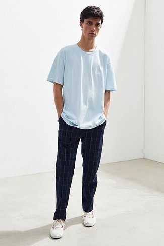 Navy Check Chinos Outfits: Display your expertise in men's fashion by combining a light blue crew-neck t-shirt and navy check chinos for a laid-back getup. If not sure as to what to wear in the shoe department, go with a pair of white and red canvas low top sneakers.