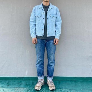 Light Blue Denim Jacket Outfits For Men: Consider wearing a light blue denim jacket and blue jeans for both sharp and easy-to-create look. You can get a bit experimental in the footwear department and complement this look with beige athletic shoes.