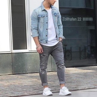 Charcoal Ripped Skinny Jeans Outfits For Men: Pair a light blue denim jacket with charcoal ripped skinny jeans for both dapper and easy-to-style look. White athletic shoes look awesome here.