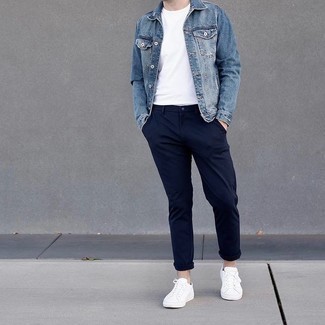 Denim Jacket Outfits For Men: Why not consider teaming a denim jacket with navy chinos? These items are totally functional and will look amazing when paired together. A pair of white canvas low top sneakers adds more character to your getup.