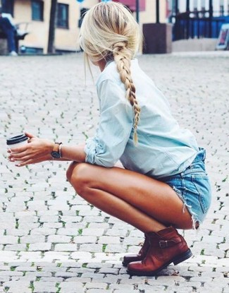 Blue Denim Shorts Outfits For Women: Go for a pared down yet edgy and casual ensemble marrying a light blue denim shirt and blue denim shorts. Complete your look with a pair of brown leather ankle boots to change things up a bit.