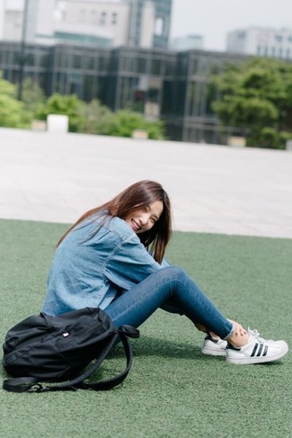 Women's Light Blue Denim Shirt, Blue Skinny Jeans, White and Black Leather Low Top Sneakers, Black Canvas Backpack