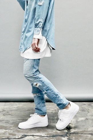 Light Blue Denim Shirt Outfits For Men: If you're all about being comfortable when it comes to your personal style, this combination of a light blue denim shirt and light blue ripped jeans is right what you need. A trendy pair of white leather low top sneakers is an easy way to upgrade this getup.