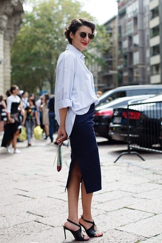 Navy Pencil Skirt Outfits: Team a light blue dress shirt with a navy pencil skirt and you'll be the picture of sophistication. We're loving how cohesive this outfit looks when rounded off with a pair of black leather heeled sandals.