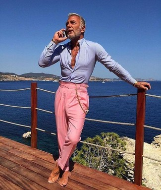 This combination of a light blue dress shirt and pink dress pants oozes refined elegance.