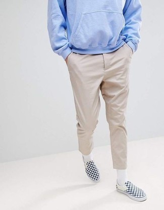 Light Blue Hoodie Outfits For Men: Pair a light blue hoodie with beige chinos to put together a really sharp and modern-looking casual outfit. Our favorite of a variety of ways to finish off this ensemble is a pair of navy check canvas slip-on sneakers.