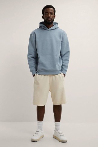 Light Blue Hoodie Outfits For Men: If you don't take fashion too seriously, go for casually dapper menswear style in a light blue hoodie and beige sports shorts. Infuse this getup with a sense of sophistication by slipping into white leather low top sneakers.