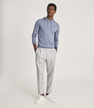 Light Blue Hoodie Outfits For Men: A light blue hoodie and grey chinos are a good combination worth integrating into your casual styling arsenal. White leather low top sneakers are a welcome accompaniment to your look.