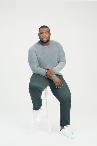 Light Blue Long Sleeve T-Shirt Outfits For Men: A light blue long sleeve t-shirt and dark green chinos are both versatile menswear staples that will integrate well within your current lineup. Our favorite of a countless number of ways to finish this getup is white leather low top sneakers.
