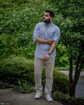 Light Blue Linen Long Sleeve Shirt Outfits For Men: If you don't like spending too much time on your combinations, wear a light blue linen long sleeve shirt and beige jeans. Complete your ensemble with a pair of white leather low top sneakers and you're all set looking smashing.