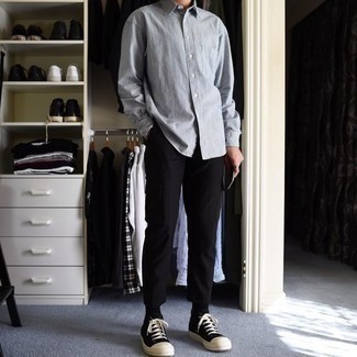 Black High Top Sneakers Outfits For Men In Their 30s: This look with a light blue chambray long sleeve shirt and black chinos isn't hard to score and is easy to adapt. A trendy pair of black high top sneakers is the most effective way to inject a sense of stylish nonchalance into your getup. If you often wonder how to dress maturely while looking stylish, this combination is a practical example.