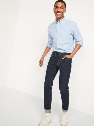 Navy Socks Outfits For Men: Try teaming a light blue long sleeve shirt with navy socks for an unexpectedly cool look. A pair of white canvas high top sneakers will take this outfit in a more sophisticated direction.