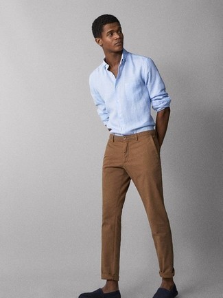 Navy Canvas Espadrilles Outfits For Men: This ensemble with a light blue long sleeve shirt and brown chinos isn't hard to pull off and is easy to change. If you're wondering how to round off, add navy canvas espadrilles to the mix.