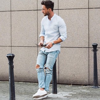 This is solid proof that a light blue long sleeve shirt and light blue jeans look awesome when married together in a casual menswear style. White low top sneakers will be a welcome accompaniment for this outfit.