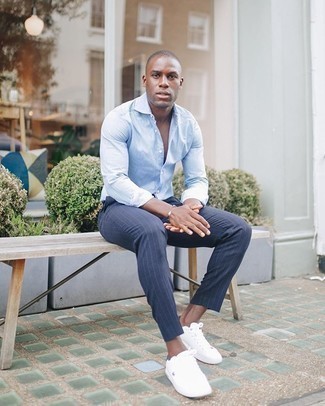 Navy Vertical Striped Chinos Outfits: Wear a light blue long sleeve shirt and navy vertical striped chinos to create a daily look that's full of style and personality. White canvas low top sneakers are a savvy pick to round off your outfit.