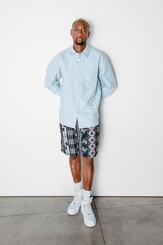 Navy Paisley Shorts Outfits For Men: For practicality without the need to sacrifice on good style, we like this combo of a light blue long sleeve shirt and navy paisley shorts. Add a different twist to an otherwise mostly classic outfit by rocking a pair of white leather high top sneakers.