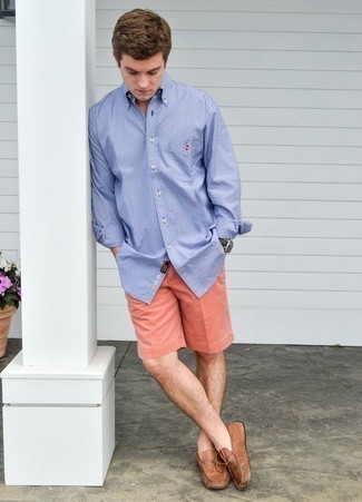 Hot Pink Shorts Outfits For Men: Consider wearing a light blue long sleeve shirt and hot pink shorts for comfort dressing with a modern finish. Let your expert styling truly shine by completing this look with a pair of tan leather driving shoes.